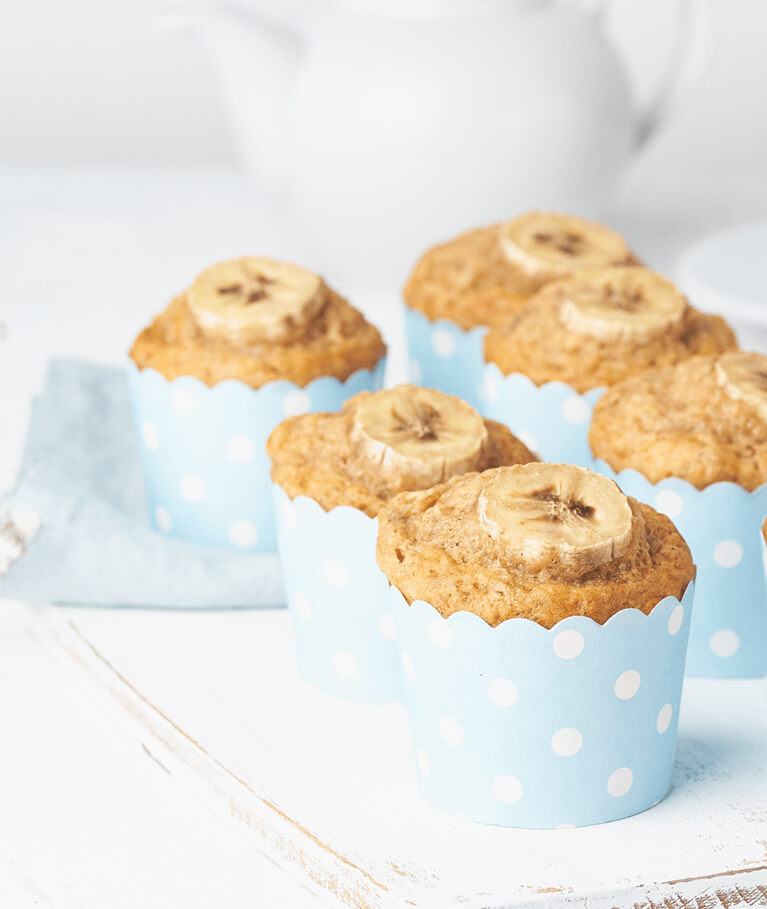 banana muffin cupcakes in blue cake cases paper wh TXJHDYF 03